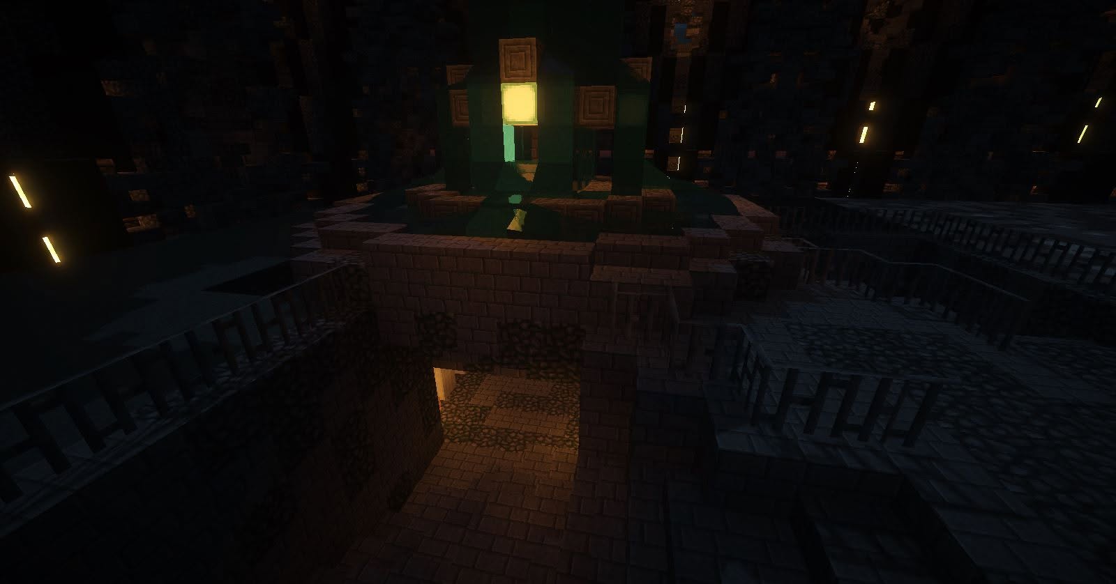 Dark stone tower topped with a glowing green lantern at night